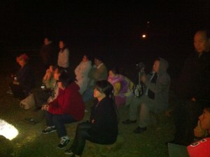 Listening to testimony during campfire.